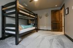 Iro n Wood Lodge bedroom with bunk beds. 